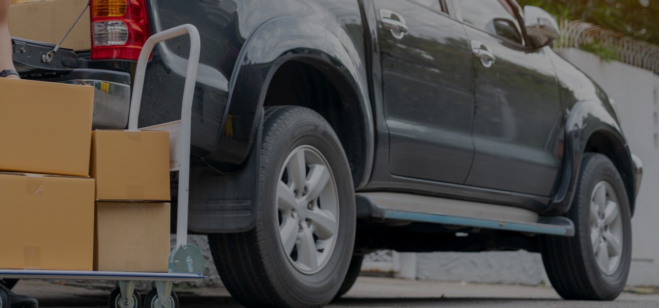 Pickup truck being loaded with boxes
