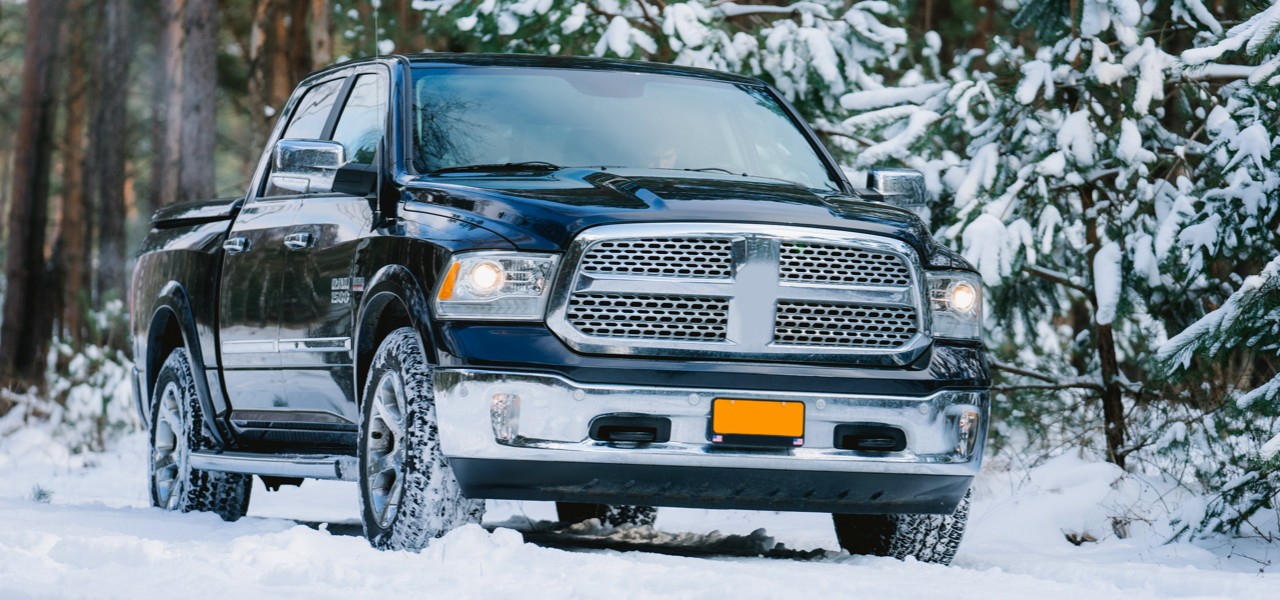 Large pickup truck going through snow